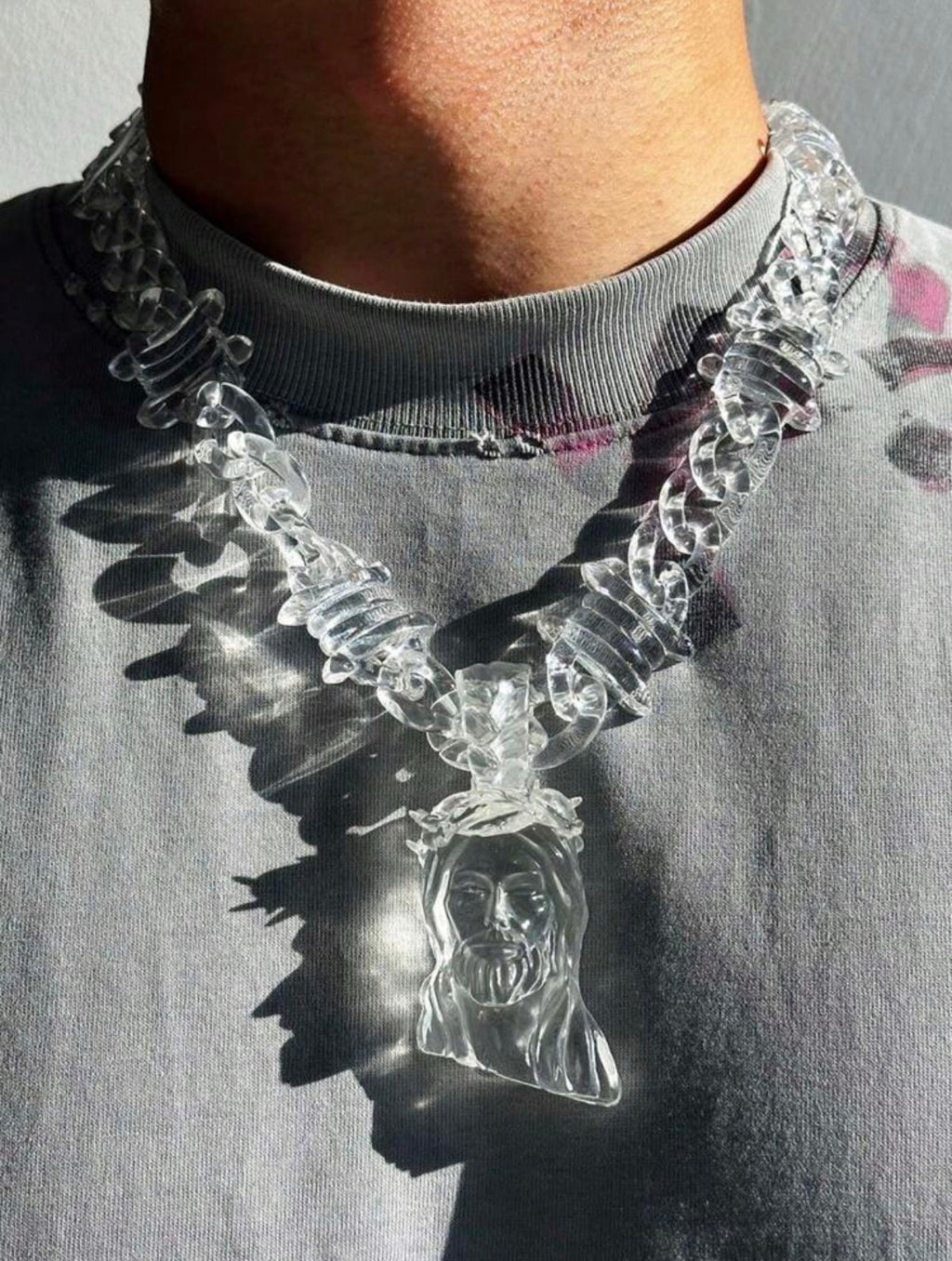 Transparent Blessers Jesus Statement Chain reflecting sunlight